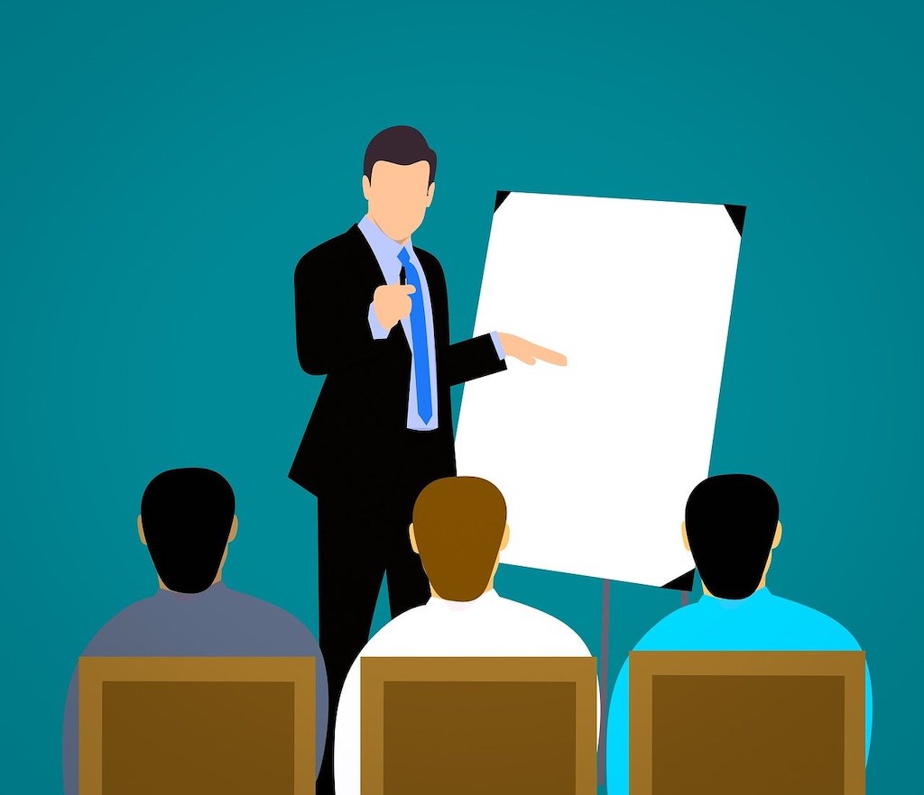 illustration of a person leading a presentation to a small audience